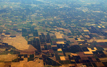 Aerial view of the Central Valley, showing agricultural fields and housing developments.